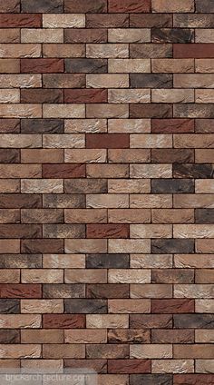 a brown brick wall that is very close to the ground