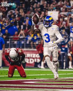 a football player throwing a ball on top of a field with people watching from the stands