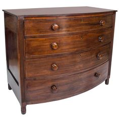 a wooden dresser with four drawers on one side