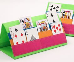 playing cards are placed in the pocket of an origami card holder