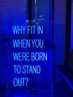 a neon sign that says, why fit in when you were born to stand out?