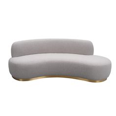 the curved sofa is made from grey fabric and gold metal legs, with an oval shaped back