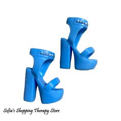 pair of blue shoe clips on white background