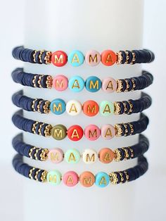 Multi Colored MAMA word beaded stretch bracelet NAVY ~ Two and Crew Trendy Adjustable Letter Beaded Bracelets, Adjustable Multicolor Stretch Bracelet With Letter Print, Trendy Personalized Heishi Beads Stretch Bracelet, Adjustable Multicolor Letter Print Stretch Bracelet, Personalized Trendy Heishi Beads Stretch Bracelet, Trendy Jewelry With Letter Print On Round Beads, Casual Gold Stretch Bracelet With Colorful Beads, Adjustable Letter Beads Stretch Bracelet For Friendship, Trendy Heishi Beads Bracelet With Letter Beads