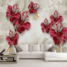 the living room wall is decorated with red flowers and pearls on it's side