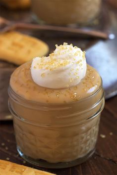 a dessert in a jar with whipped cream on top