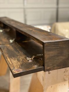 a close up of a wooden bench with metal brackets on the top and bottom part