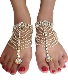 Bollywood Indian Bridal Wedding Pearl Gold Plt Kundan Stone Chain Pair Anklets Anklet Payal Belly Dance Boho Jewelry for women Courier-Ship Pair Of Ethnic Traditional Jewelry Anklet / Payal Shipping by UPS Private Courier with tracking Size:- 28cm/11inch Delivery time 10-12 days You will receive a pair of these anklets. Hand Crafted From Finest Alloy by Skilled artisans of India Really Beautiful, Light weight And Very Comfortable Elegant and Traditional Condition : Brand New ------------- White Toe Ring Anklets For Party, Traditional Gold Beaded Anklets, Adjustable Anklets For Parties, Traditional Barefoot Sandals For Festivals And Parties, Elegant Stone Work Anklets For Festive Occasions, Elegant Stone Work Anklets For Wedding, Gold Beaded Anklets For Party, Silver Wedding Anklets With Latkans, Adjustable Traditional Anklets For Party