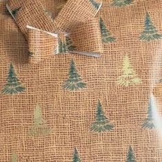 a brown shirt with trees on it