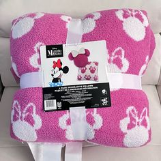 the minnie mouse pillow is pink with white hearts