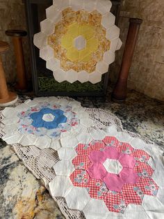 three quilts are sitting on the table next to each other