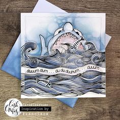 a card with an image of a shark in the ocean and words on it that say,