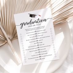 a graduation checklist on a plate next to an open book