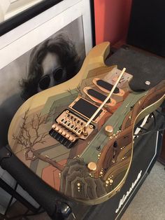 an electric guitar is sitting on top of a case