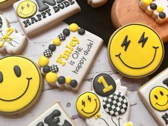 decorated cookies with smiley faces and numbers on them