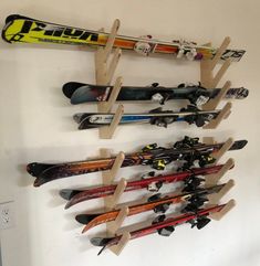 there are many skis hanging on the wall