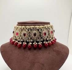 - Beautiful Minimalistic Red Choker Set - Perfect for bridesmaids boxes  - Perfect for Weddings, Brides, Casual Events, Diwali, Eid  - 100% Satisfaction Guarantee: Long Lasting Plating, High-Quality Stones - Adjustable neck width  - Small to Medium size - Wearable with any outfit - Easy to wear and remove - Premium Quality and High craftsmanship Care Tips - Keep away from water, perfume and other chemicals - Store it in a zip lock or container/box - Avoid direct heat Please contact us for any qu Red Choker Necklace, Red Choker, Indian Choker, Indian Choker Necklace, Pink Choker, Blue Choker, Gold Necklace Indian, Necklace Set Indian, Bridal Necklace Set