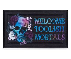 a door mat with a skull and flowers on it that says, welcome toolish mortals