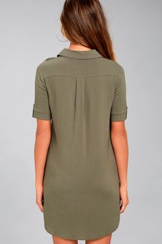 Your punctuation is on point, and so is your outfit, thanks to the Lulus Oxford Comma Olive Green Shirt Dress! Lightweight fabric constructs this woven shirt dress with a collared neckline, short sleeves (with button tabs), and front patch pockets. Full button placket. Hidden side seam pockets. Fit: This garment fits true to size. Length: Mid-thigh. Size medium measures 34.5" from shoulder to hem. Bust: Great for any cup size. Waist: Not Fitted - comfortable room throughout midsection. Hip: Not Casual V-neck Shirt Dress With Placket, Spring Collared Shirt Dress With Roll-up Sleeves, Fitted Collared Shirt Dress For Work, Formal Collared Shirt Dress With Placket, V-neck Shirt Dress With Placket For Daywear, Short Sleeve Shirt Dress With Buttons For Work, Summer Collared Shift Shirt Dress, Chic Collared Short Sleeve Dress, Semi-formal Fitted Short Sleeve Shirt Dress