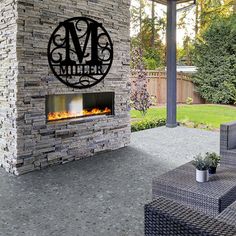 an outdoor fireplace with the initials m and m on it