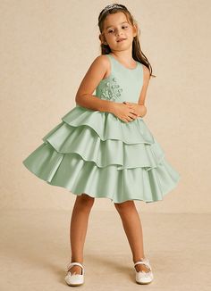 Cupcake features a sweet A-line silhouette in matte satin, accented with a delightful scoop neckline and playful bows. Its sleeveless design adds a cheerful touch, making it an adorable choice for any special occasion. Girls Clothes Design, Sage Flower Girl Dress, Satin Flower Girl Dresses, Cupcake Flower, Dusty Sage, Sage Dress, Military Ball Dresses, Special Event Dresses, Lace Bride