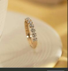 a close up of a wedding ring on a plate