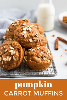 pumpkin carrot muffins on a cooling rack with cinnamon sticks and milk in the background