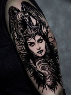 a black and white tattoo with an image of a woman wearing a crown on her head