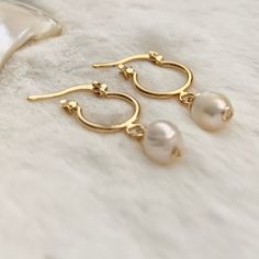 Excited to share this item from my #etsy shop: Tiny gold hoops, Pearl hoop earrings gold, Dainty hoop earrings, jr bridesmaid gift, huggie hoop earrings gold, delicate bridal earrings. #gold #wedding #circle #lovefriendship #pearl #shell #latchback #minimalist #hoops #minihoops #freshwaterpearls #bridesmaid #bridetobe Gold-plated Hoop Earrings With Pearl Drop For Anniversary, Gold Plated Hoop Earrings With Pearl Drop For Anniversary, Delicate Gold Round Huggie Earrings, Gold Hoop Bridal Earrings With Pearl Drop, Minimalist Gold Huggie Earrings For Wedding, Gold Delicate Huggie Earrings With Pearl Charm, Wedding Huggie Hoop Earrings With Pearl Drop, Delicate Gold Huggie Earrings With Pearl Charm, Delicate Gold Huggie Earrings With Ear Wire