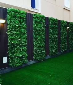 an artificial grass wall in front of a building