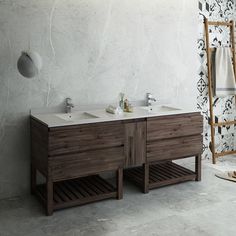 a bathroom with two sinks and a ladder in the wall next to it on concrete flooring