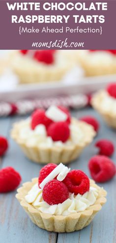 white chocolate raspberry tarts are topped with whipped cream and fresh raspberries