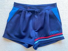 Beautiful authentic belted high rise swim shorts from the 1970s by Stiga. Made from a comfortable stretchy polyester fabric. Navy blue as the main colour. Details in blue and red. Navy blue belt trimming. Two pockets. Small slits on sides. Stiga logo and stripes on the left leg. Waist 74 cm (flat, without stretching the elastic at the waist) Outside leg 33 cm Estimated current size M. NB! FOR EXPRESS DELIVERY WITH DHL I NEED YOUR E-MAIL ADDRESS AND PHONE NUMBER. THESE WILL ONLY BE USED FOR DHL D Retro Blue Swim Bottoms, Retro Blue Swimming Bottoms, Fitted Retro Blue Shorts, Fabric Navy, Blue Belt, Retro Shorts, Mens Swim Trunks, Estonia, Main Colors