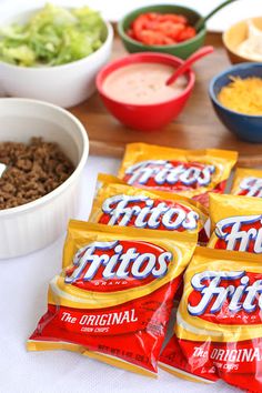 chips and dips are laid out on a table