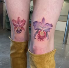 two tattoos on the legs of women with flowers