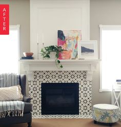 a living room filled with furniture and a fire place under a painting on the wall