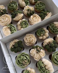 cupcakes with green and white frosting in a box next to each other