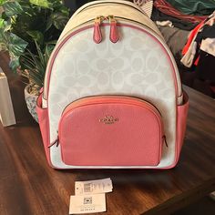 Brand New Pink And White Leather Coach Backpack Never Used Still Have The Tags And Is In Pristine Condition Luxury White Leather Backpack With Adjustable Strap, Luxury White Standard Backpack, White Backpack With Detachable Strap For Errands, Luxury White Backpack With Detachable Strap, White Travel Backpack With Detachable Strap, White Luxury Leather Backpack For Daily Use, Luxury White Leather Backpack For Daily Use, White Backpack With Detachable Strap, White Luxury Backpack With Removable Pouch