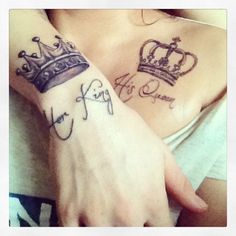 two people with tattoos on their arms, one has a crown and the other has an inscription