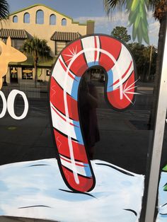 there is a large candy cane in the window