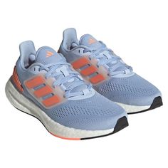 the adidas running shoes are light blue and orange