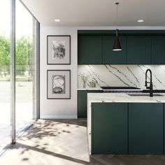 a kitchen with green cabinets and marble counter tops