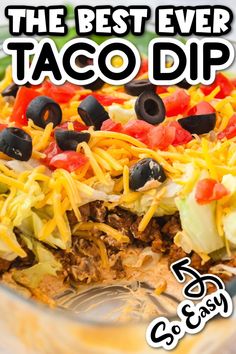 the best ever taco dip recipe in a casserole dish with cheese and black olives