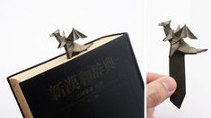 an origami book is folded and placed on top of a book with the pages folded down