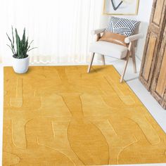 a living room with a yellow rug and chair