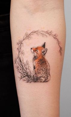 an image of a fox tattoo on someone's leg and it is being displayed