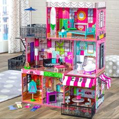 a doll house with furniture and accessories on the floor