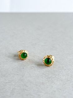 Introducing our stunning Grade A Imperial Green Jade 18K Gold Ear Studs, where everyday elegance meets distinctive design. Crafted to capture attention and inspire awe, these ear studs are more than just accessories; they're timeless statements of individuality. Each stud features a radiant Grade A Imperial Green Jade gemstone, carefully selected for its exceptional quality and captivating hue. Sourced from the lush landscapes of Myanmar, this jade embodies the essence of natural beauty, infusing each piece with a sense of serenity and vitality. What sets these ear studs apart is their unique design. The Grade A Imperial Green Jade is masterfully inlaid with matte-finished 18K gold, creating a harmonious fusion of textures and tones. The juxtaposition of the smooth jade against the velvety Gold Earring Studs, Gold Ear Studs, Jade Gemstone, Everyday Elegance, Earring Studs, Gold Earring, Yellow Gold Earring, Green Jade, Jade Green