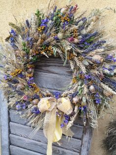 a wreath is hanging on the side of a door