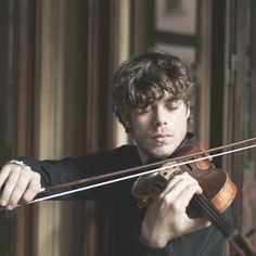 a man holding a violin with the words bow movement exercises for beginning violinists